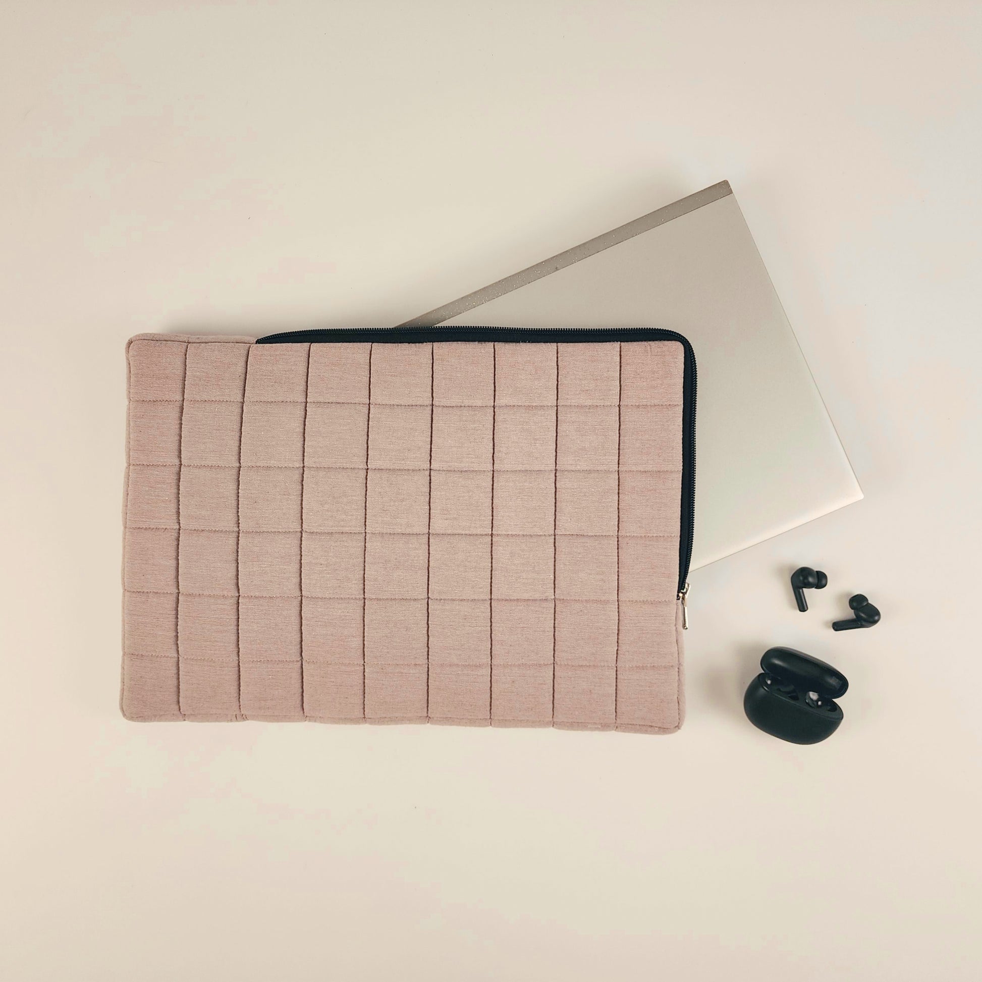 Thin, lightweight laptop sleeve with added cushioning for optimal protection. Designed to guard your laptop against scratches, bumps, and minor impacts while maintaining a slim profile for easy portability. Perfect for slipping into bags or carrying on its own.